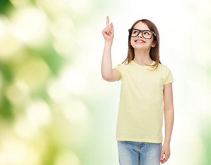 Image showing smiling cute little girl in black eyeglasses