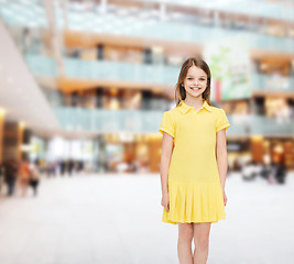 Image showing smiling little girl in yellow dress