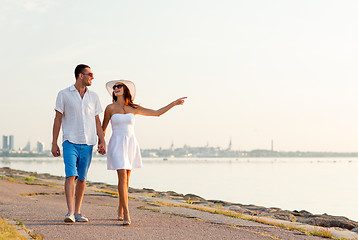 Image showing smiling couple walking outdoors