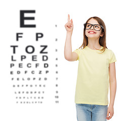 Image showing smiling cute little girl in black eyeglasses