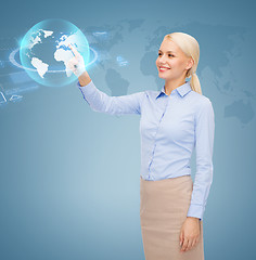 Image showing smiling businesswoman working with virtual screen