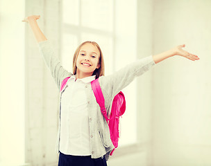 Image showing student girl with hands up at school