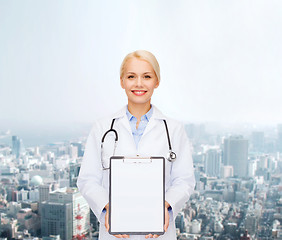 Image showing smiling female doctor with clipboard