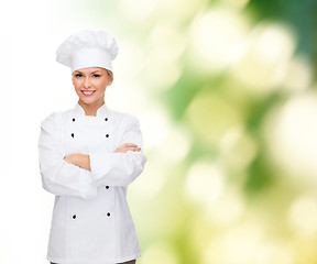 Image showing smiling female chef with crossed arms