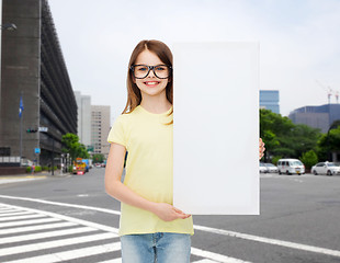 Image showing little girl wearing eyeglasses with blank board