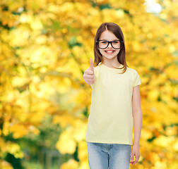 Image showing smiling cute little girl in black eyeglasses