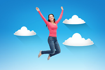 Image showing smiling young woman jumping in air