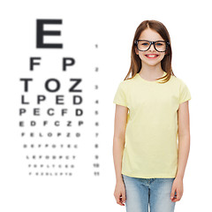 Image showing smiling cute little girl in black eyeglasses