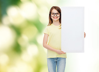 Image showing little girl wearing eyeglasses with blank board