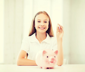 Image showing child with piggy bank