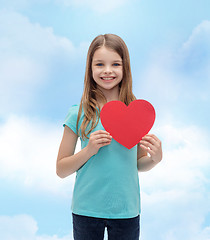 Image showing smiling little girl with red heart