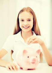 Image showing child with piggy bank