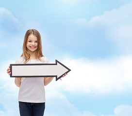 Image showing smiling girl with blank arrow pointing right