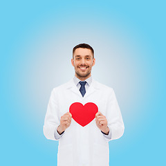 Image showing smiling male doctor with red heart