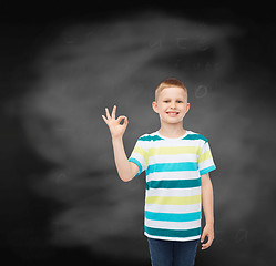 Image showing little boy in casual clothes making ok gesture