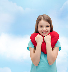 Image showing smiling little girl with red heart