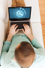 Image showing close up of man working with laptop at home