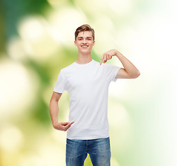 Image showing smiling young man in blank white t-shirt