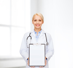 Image showing smiling female doctor with clipboard