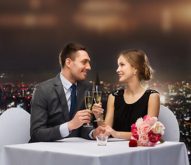 Image showing couple with glasses of champagne at restaurant