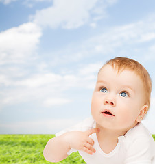 Image showing curious baby looking up