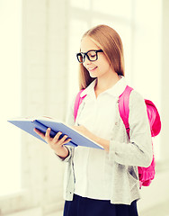 Image showing girl reading book at school