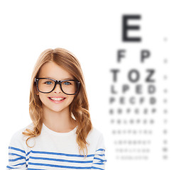 Image showing smiling cute little girl with black eyeglasses