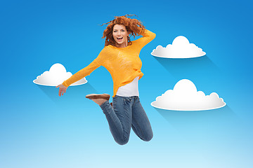 Image showing smiling young woman jumping in air