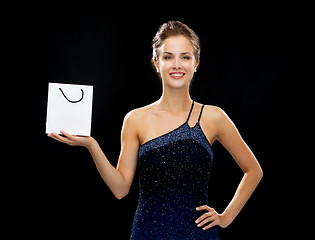 Image showing smiling woman with white blank shopping bag