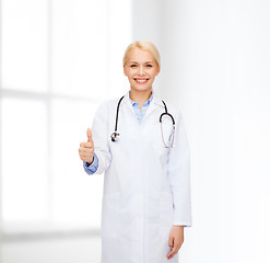 Image showing smiling female doctor showing thumbs up