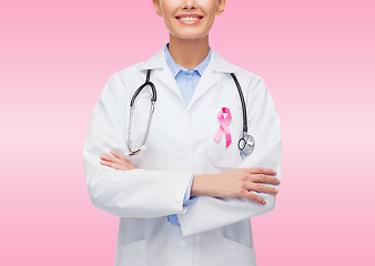 Image showing close up of doctor with cancer awareness ribbon