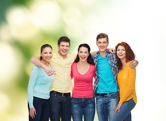 Image showing group of smiling teenagers over green background