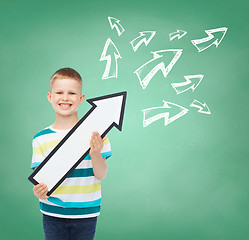 Image showing smiling little boy with blank arrow pointing right