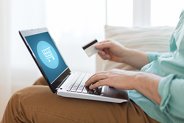 Image showing close up of man with laptop and credit card