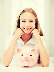 Image showing child with piggy bank