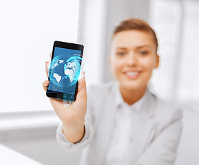 Image showing close up of businesswoman with smartphone