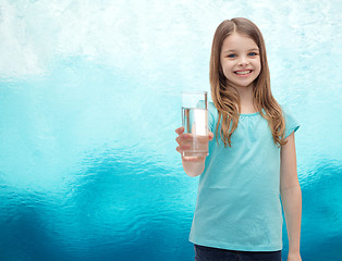 Image showing smiling little girl giving glass of water