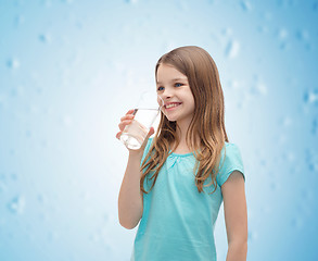 Image showing smiling little girl with glass of water