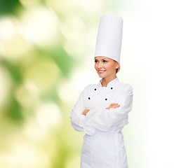 Image showing smiling female chef with crossed arms