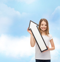 Image showing smiling little girl with blank arrow pointing up