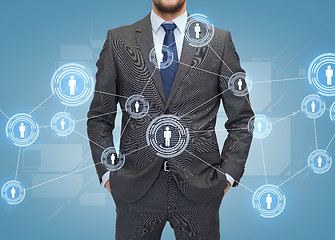 Image showing close up of businessman over blue background