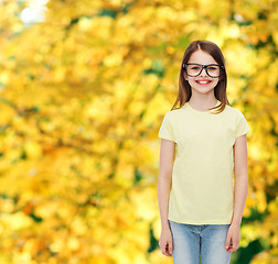 Image showing smiling cute little girl in black eyeglasses