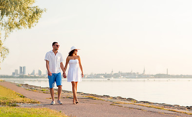 Image showing smiling couple walking outdoors