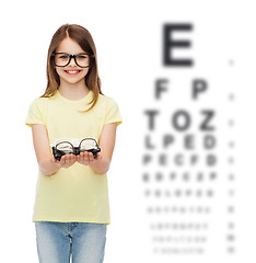 Image showing smiling cute little girl in black eyeglasses