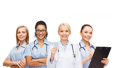 Image showing smiling female doctor and nurses with stethoscope