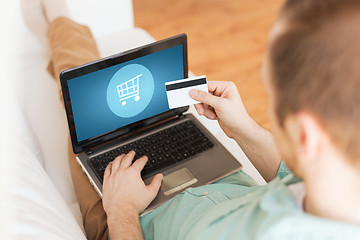 Image showing close up of man with laptop and credit card