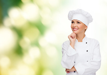 Image showing smiling female chef dreaming