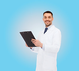 Image showing smiling male doctor with clipboard