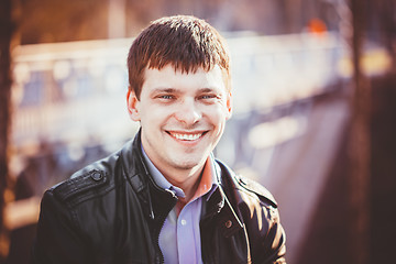 Image showing Handsome man outdoors portrait. Autumn colors.