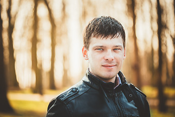 Image showing Handsome man outdoors portrait. Autumn colors.